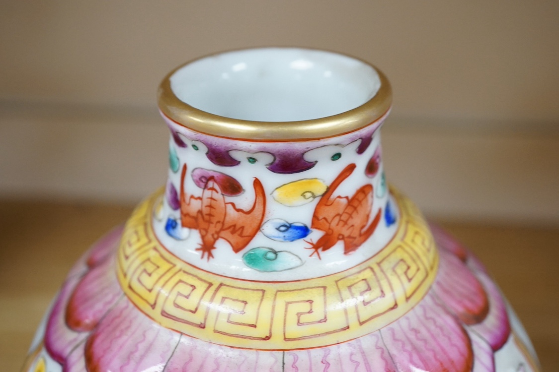 A Chinese famille rose vase enamelled with flowers, 20cm high. Condition - good